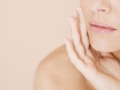 Close-up of woman holding her hand to her face